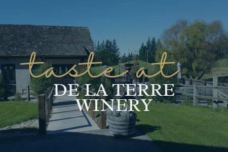 Things to Do in Hawke's Bay | Wine Tasting at De La Terre Winery | Porters Boutique Hotel - Text over hand built mud brick winery buildings.
